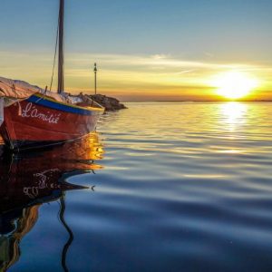 boat-on-water-at-sunrise